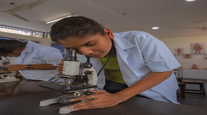 a girl is doing a practical experiment in school